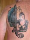 girl with gun tat on back